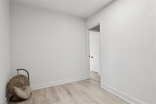 spare room featuring light hardwood / wood-style floors