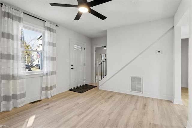 entryway featuring ceiling fan and light hardwood / wood-style floors