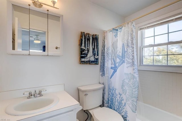 full bathroom with vanity, toilet, and shower / bath combo