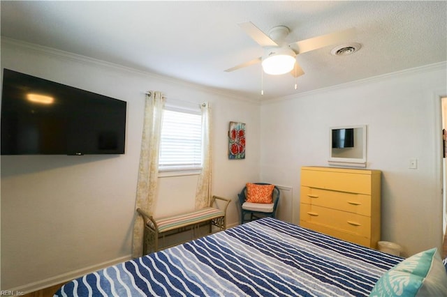 bedroom featuring ceiling fan and ornamental molding