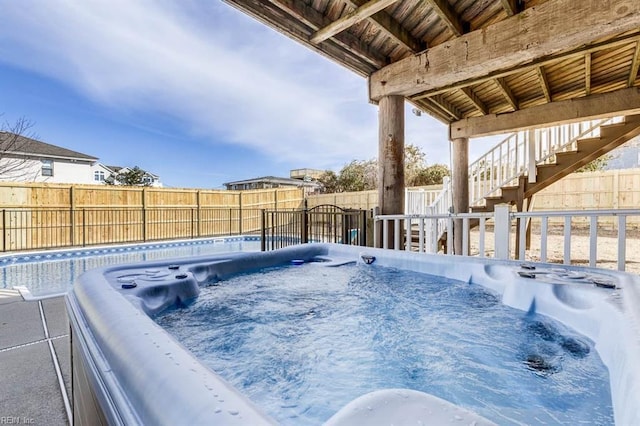 view of pool featuring a hot tub