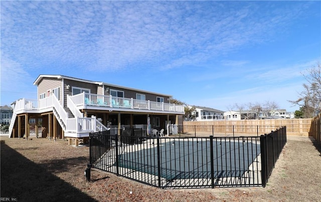 rear view of house with a patio area and a pool side deck