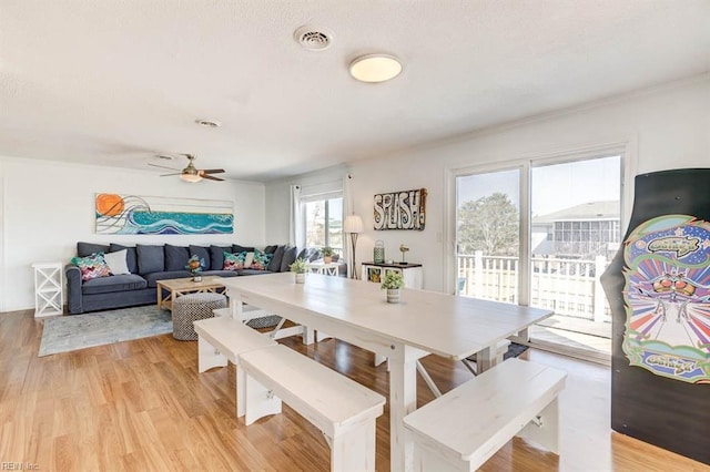 dining room featuring light hardwood / wood-style flooring and ceiling fan