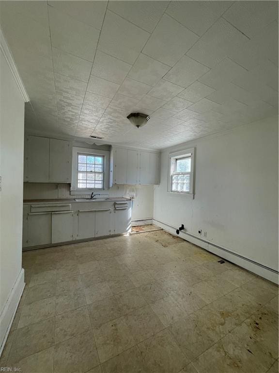 kitchen featuring a healthy amount of sunlight and sink