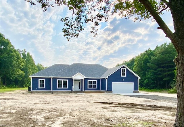 single story home featuring driveway and an attached garage