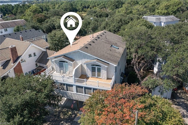 birds eye view of property with a wooded view