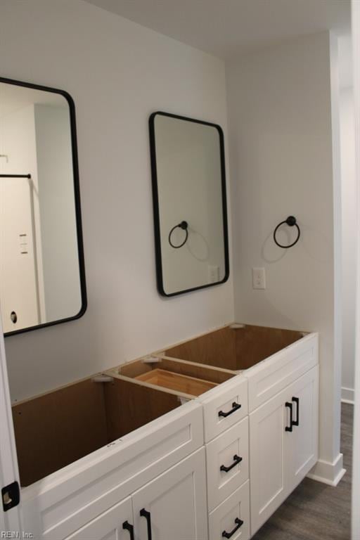 bathroom featuring vanity and hardwood / wood-style floors