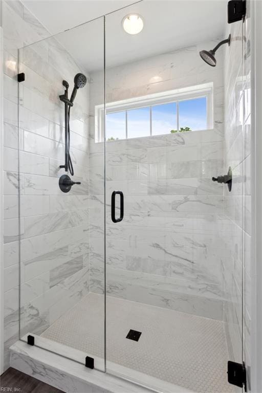 full bath featuring a shower stall