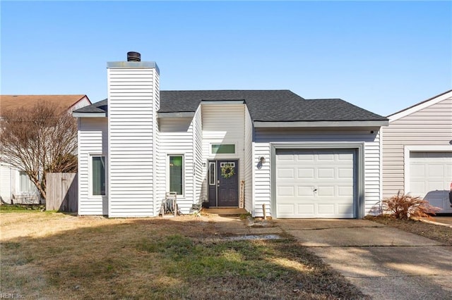 view of front facade with a front yard and a garage