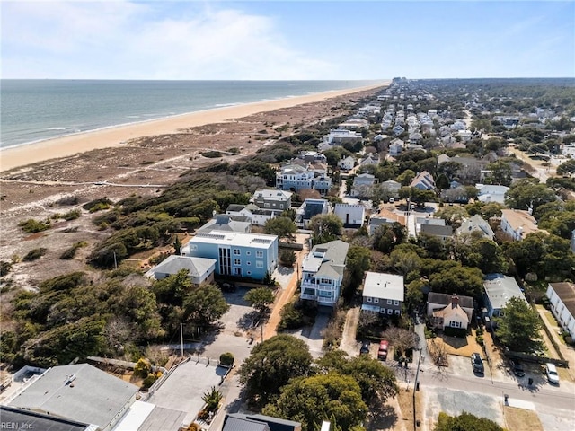 aerial view with a water view, a residential view, and a view of the beach