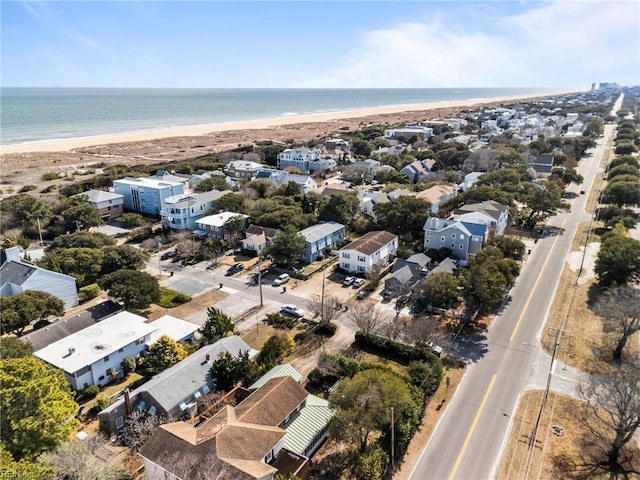 birds eye view of property featuring a residential view, a water view, and a beach view