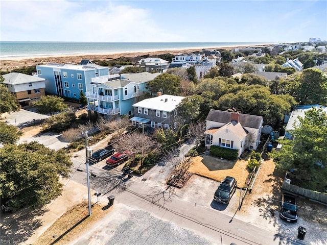 drone / aerial view with a water view and a residential view