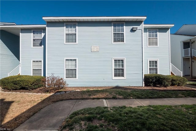 view of property exterior featuring a lawn