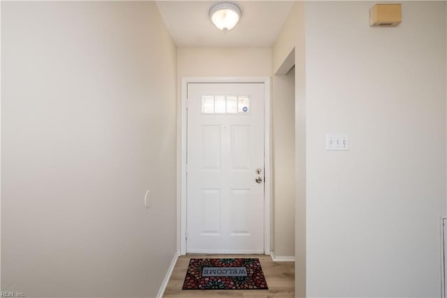 doorway with light hardwood / wood-style flooring