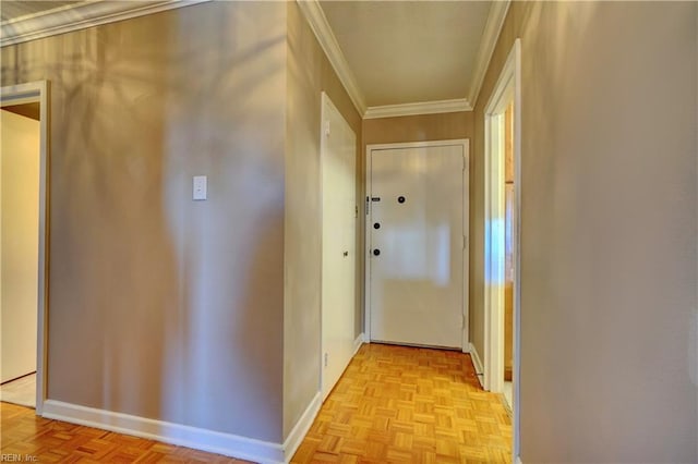 corridor with crown molding and light parquet flooring