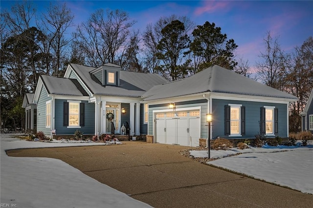 view of front of house with a garage and driveway