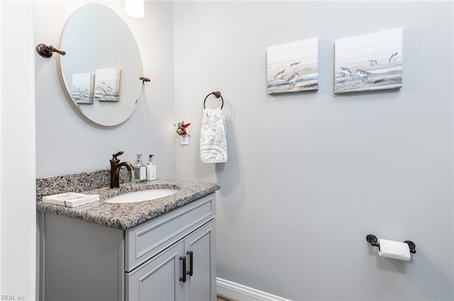 bathroom featuring vanity and baseboards