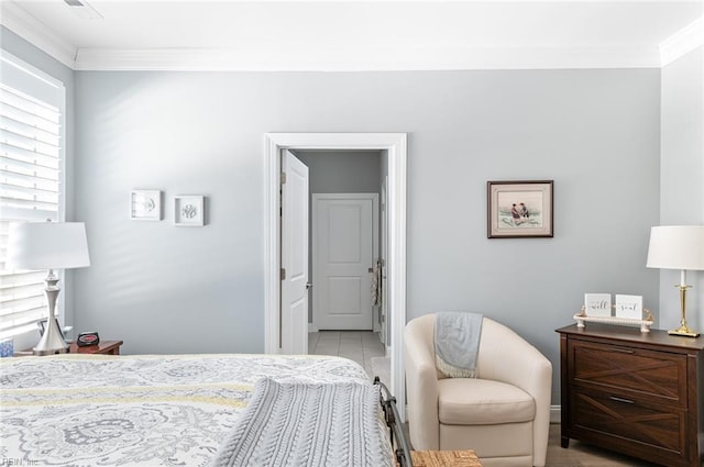 bedroom with ornamental molding