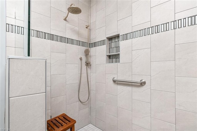 full bathroom with tiled shower