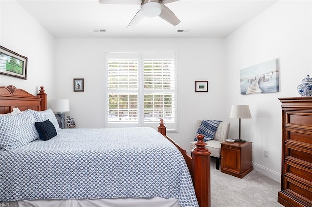 bedroom featuring visible vents, ceiling fan, light carpet, and baseboards