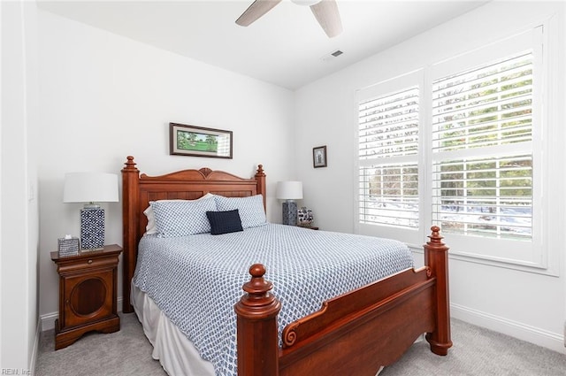 bedroom with light carpet, baseboards, visible vents, and ceiling fan