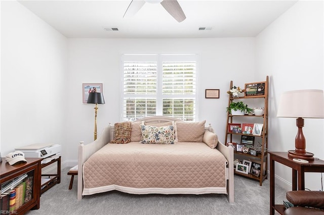 bedroom with carpet floors, visible vents, and a ceiling fan