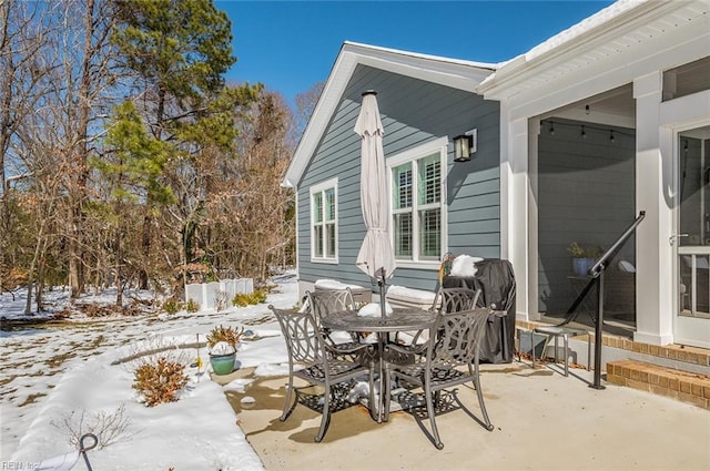 view of snow covered patio