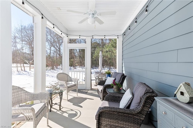 sunroom with a ceiling fan