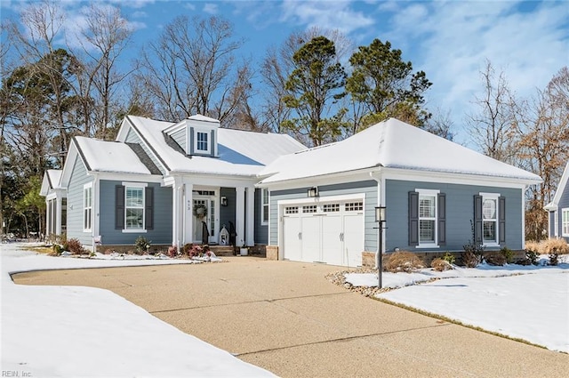 view of front of house with an attached garage and concrete driveway