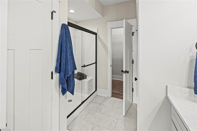 bathroom with vanity and walk in shower