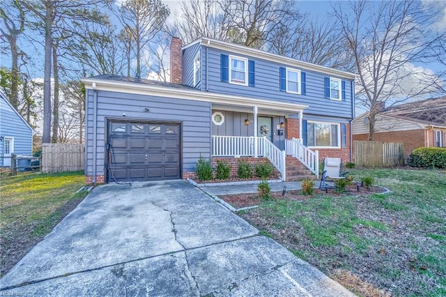 view of front of property with a front lawn and a garage