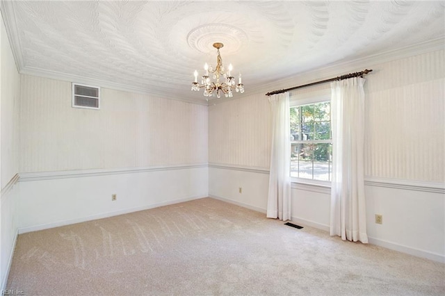 empty room featuring ornamental molding, light colored carpet, visible vents, and an inviting chandelier