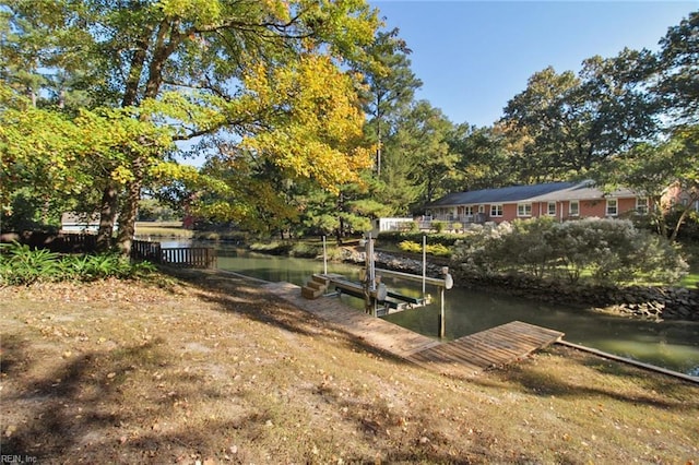 view of dock featuring a water view and boat lift