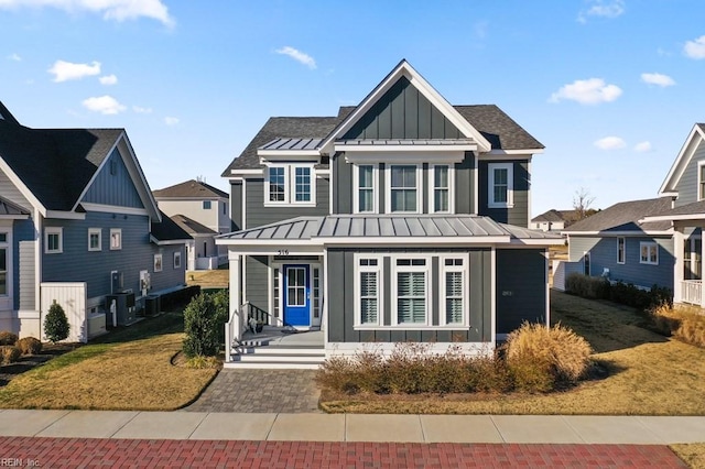 view of front of house featuring a front yard and a porch