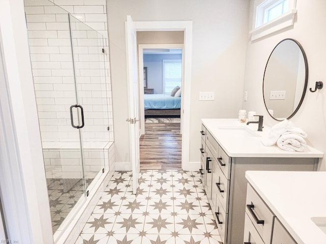 bathroom featuring an enclosed shower and vanity