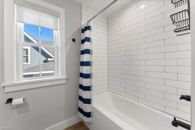 bathroom featuring shower / bathtub combination with curtain