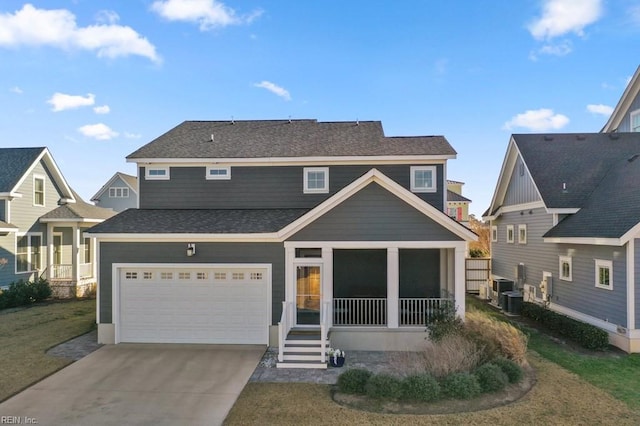 rear view of house featuring central AC, a garage, and a lawn