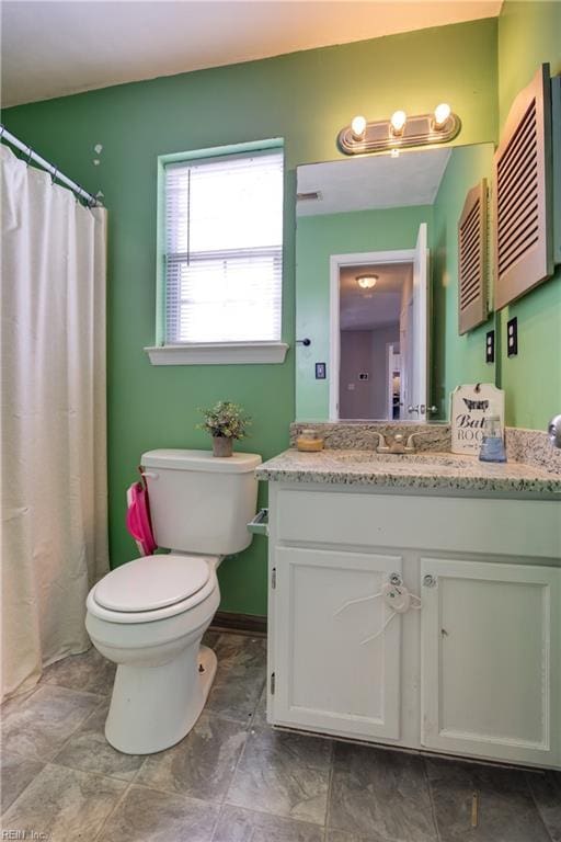 full bath with vanity and toilet