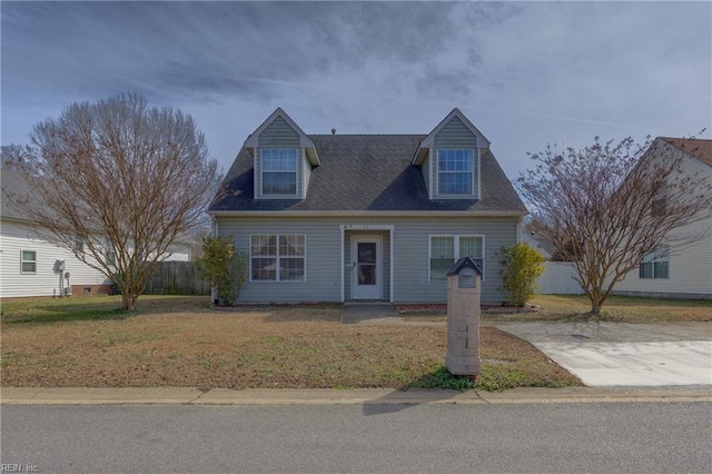 cape cod-style house with a front lawn and a shingled roof