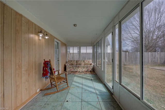 unfurnished sunroom featuring a wealth of natural light