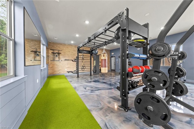 workout room with brick wall