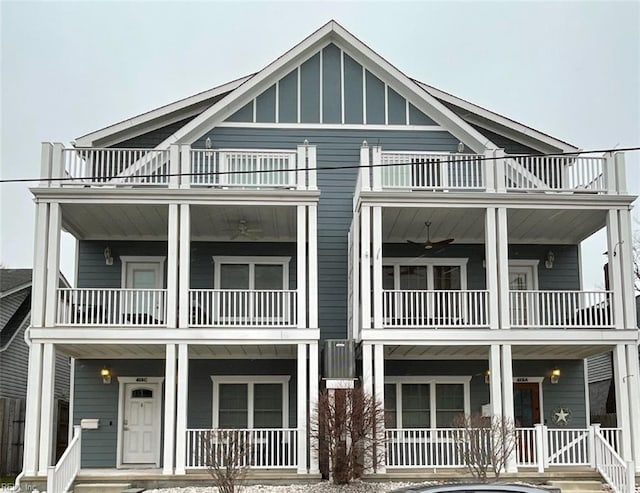 townhome / multi-family property featuring a porch and board and batten siding