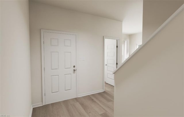 foyer entrance with light hardwood / wood-style flooring