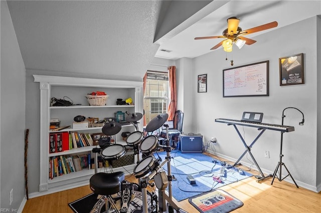 playroom featuring hardwood / wood-style flooring and ceiling fan