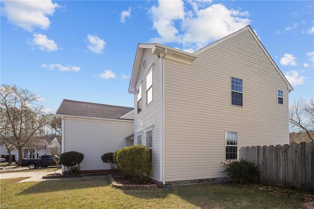 view of property exterior with a lawn