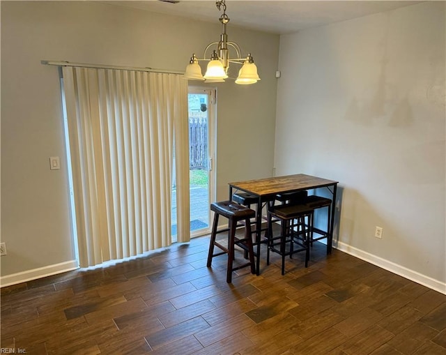 dining area featuring a chandelier and dark hardwood / wood-style flooring