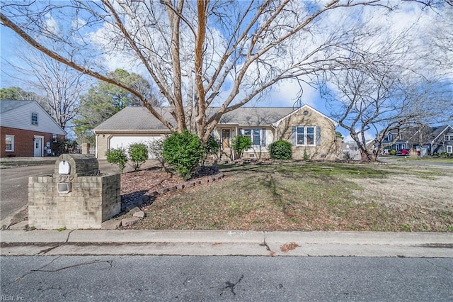 single story home featuring a garage