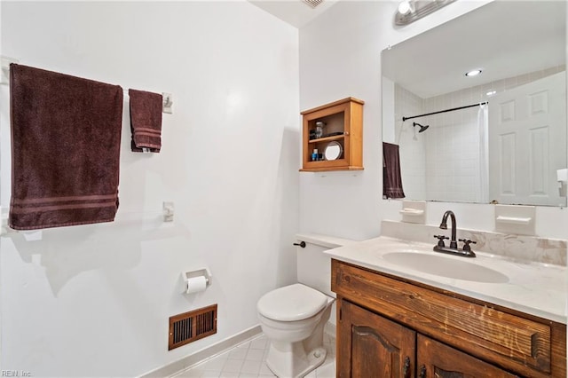 bathroom with vanity, a shower with curtain, toilet, and tile patterned floors