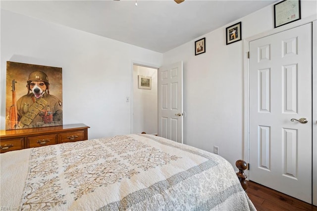 bedroom featuring ceiling fan and dark wood-type flooring