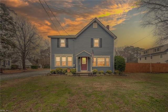 view of front of property with a yard